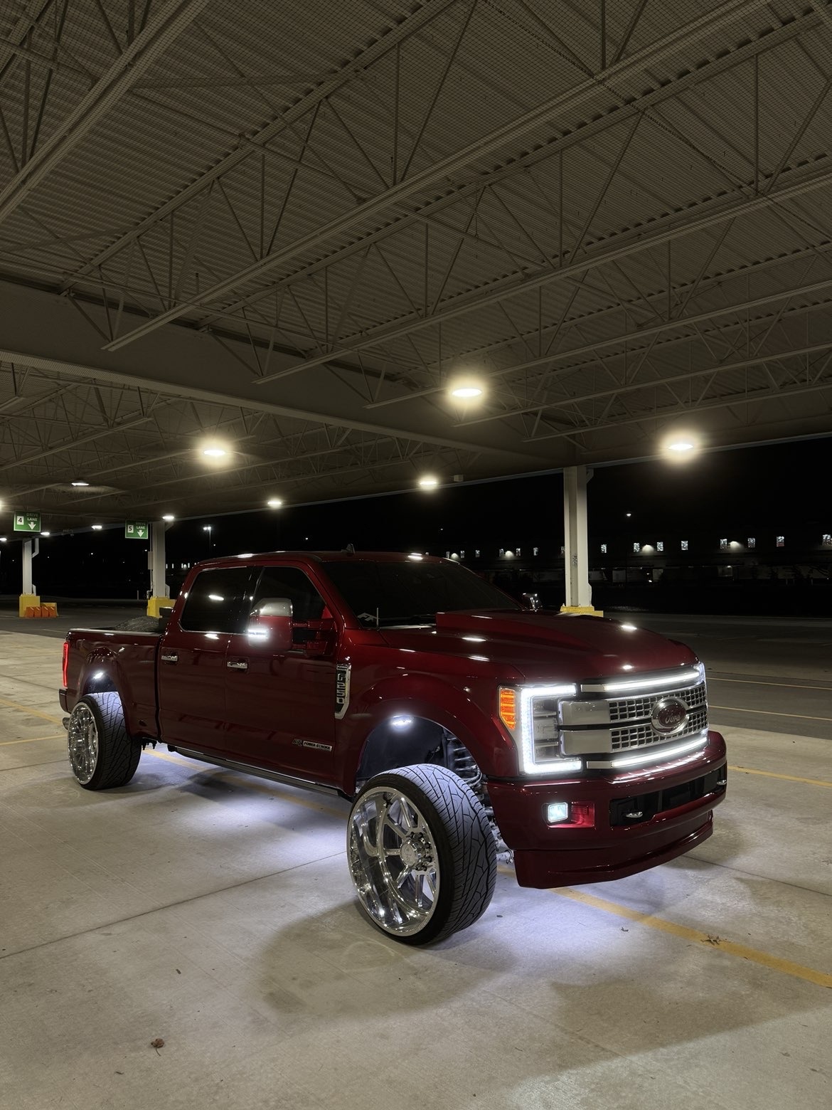 Candy red F-250 front three-quarter on Ace Forged Jackal